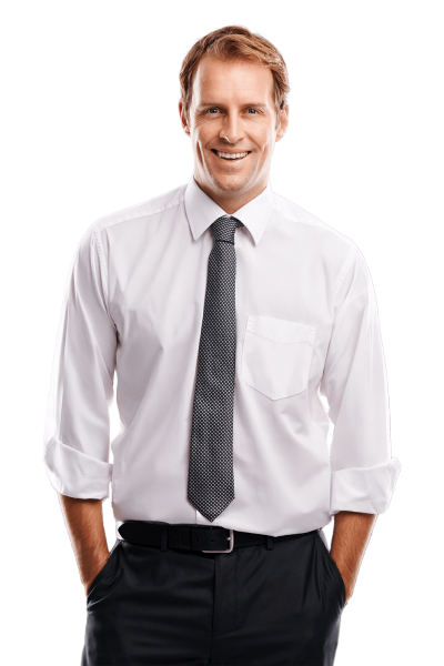 Handsome man in a clean white dress shirt with rolled-up sleeves, smiling warmly in a relaxed, casual pose.